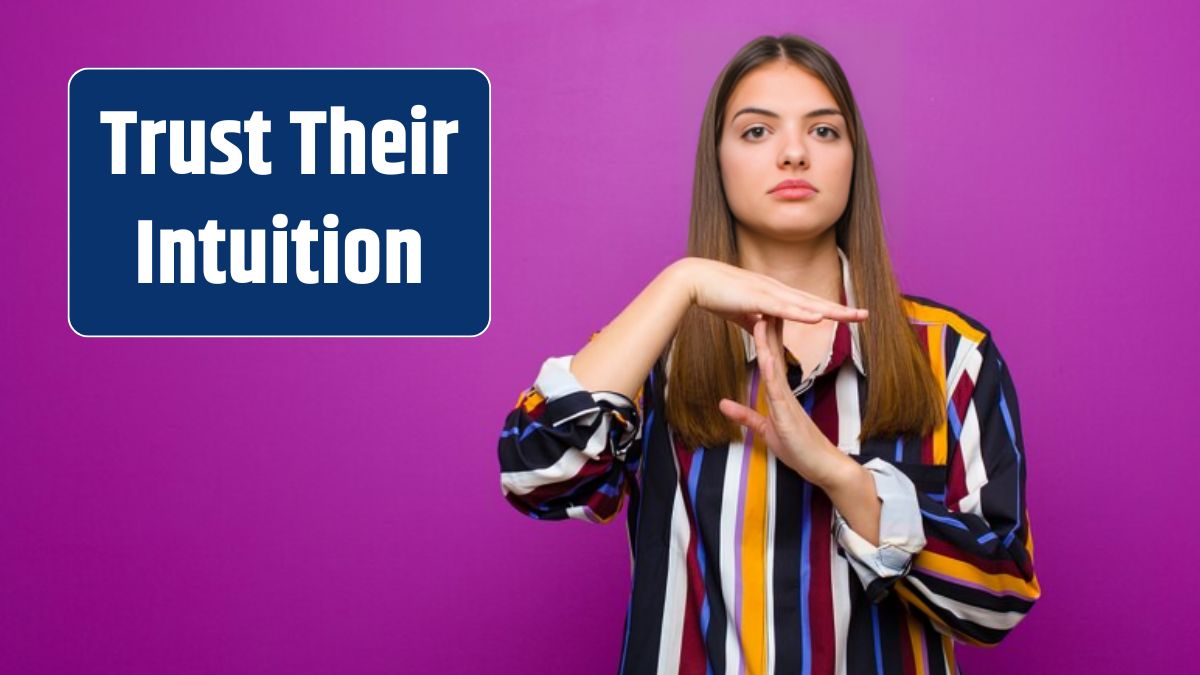 Young pretty woman looking serious, stern, angry and displeased, making time out sign against purple background.