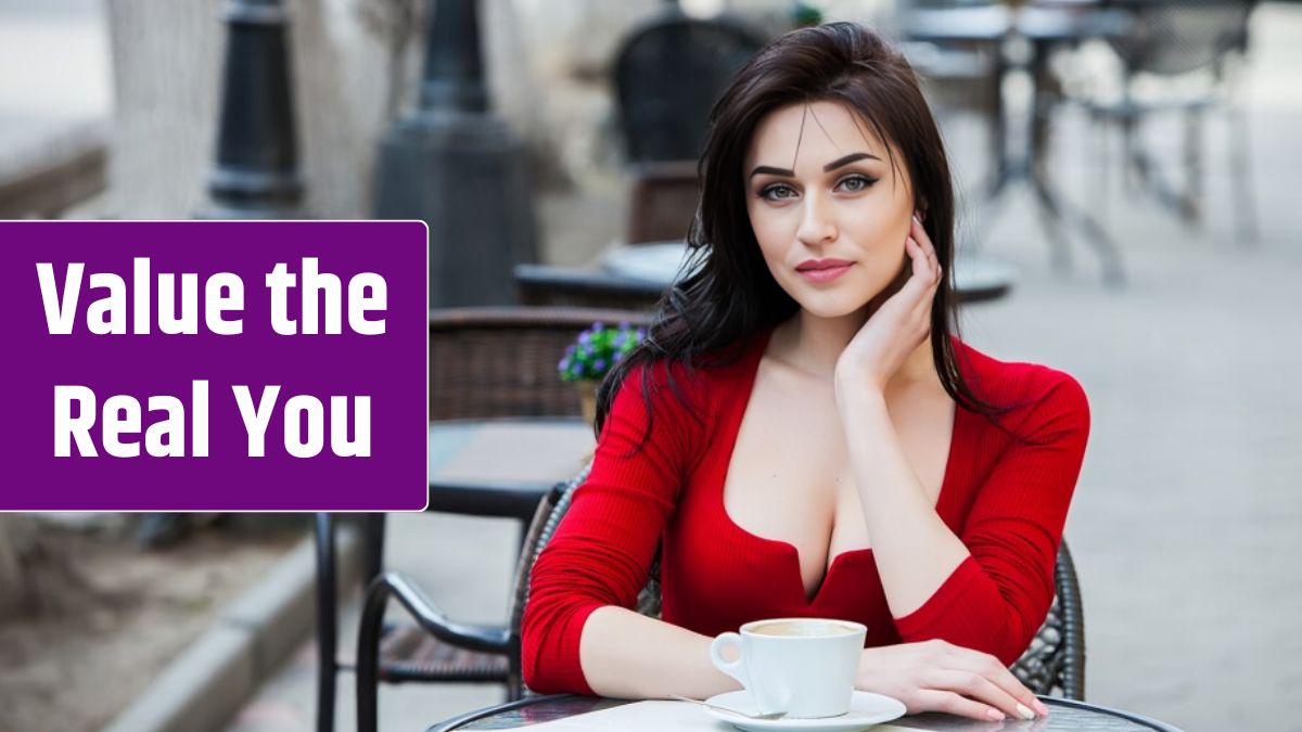 Gorgeous young woman with cup of coffee in city street.