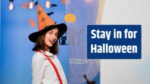 Halloween Witch with in magic hat Beautiful young surprised woman in witches hat and costume Happy young women in witch halloween costumes on party smiling.