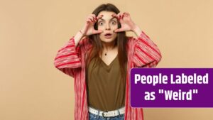 Portrait of shocked young woman in casual clothes looking camera, stretching eyelids isolated on pastel beige wall background in studio. People sincere emotions, lifestyle concept.