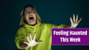 Close up portrait of young crazy scared and shocked caucasian woman isolated on dark background.