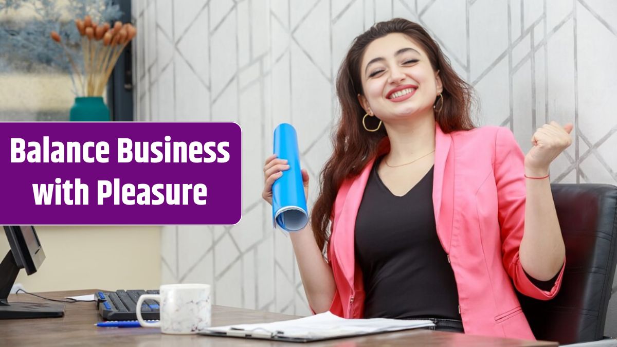 Cheerful young lady sitting behind the desk and feeling happy.