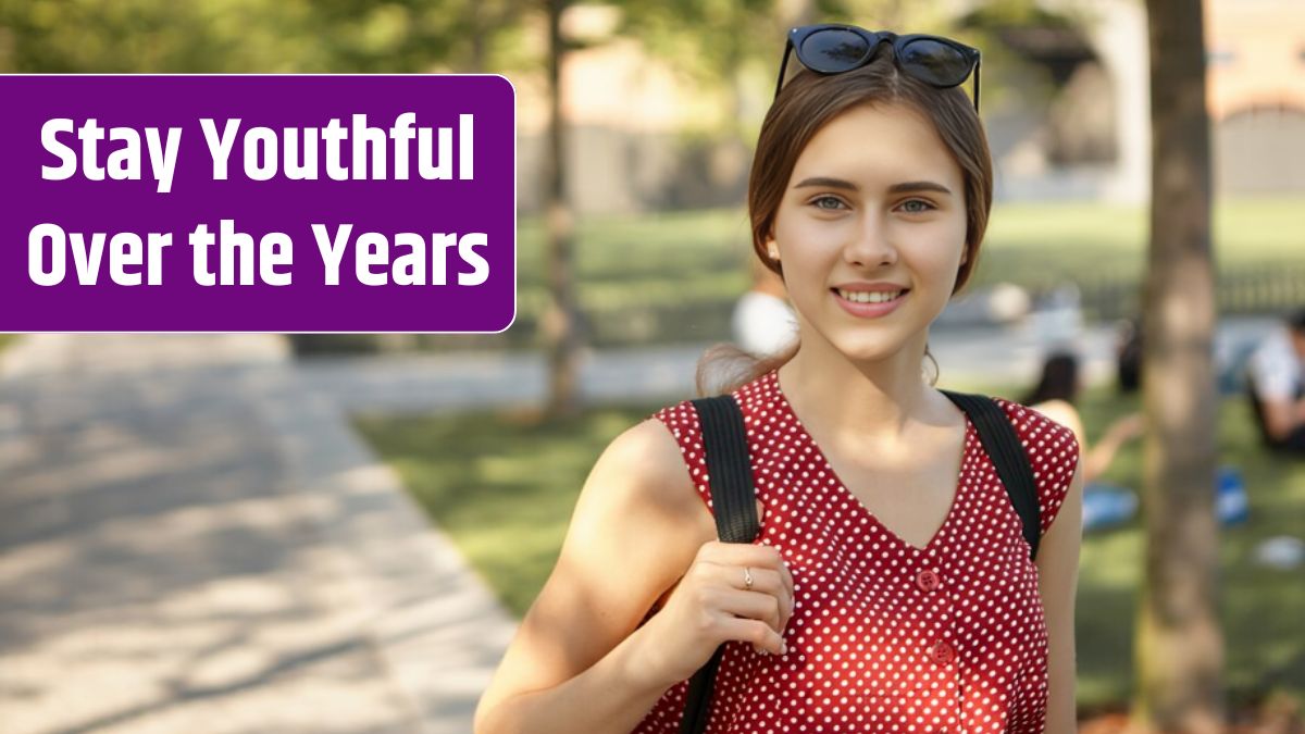 Outdoor view of beautiful cute student girl wearing dotted top and shades on her head carrying backpack, walking in park after university. Stylish woman having walk.