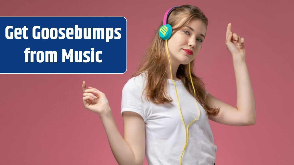 Front view young attractive female in white t-shirt dancing and listening to music on dark-pink wall model color female young girl.