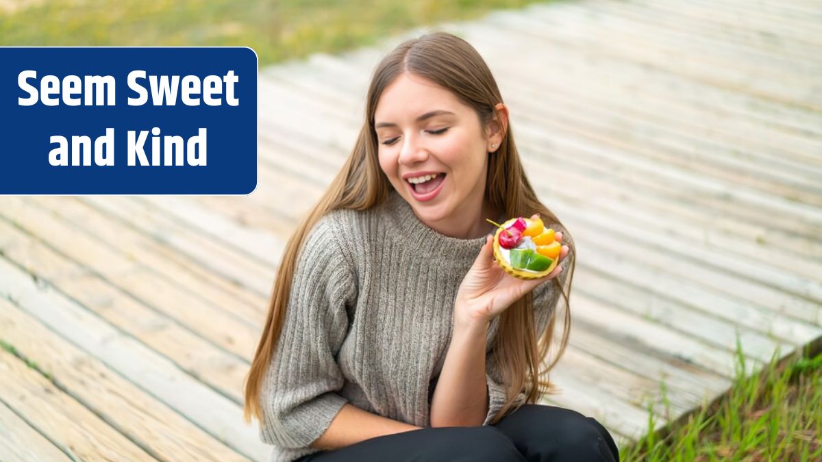 Young pretty blonde woman holding a tartlet with happy expression.